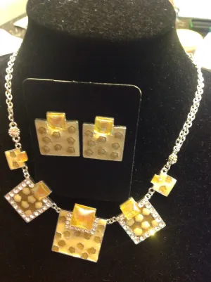 Yellow rhinestone bib style necklace and earrings.